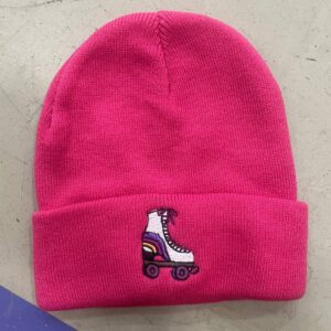 hot pink beanie with white embroidered roller skate